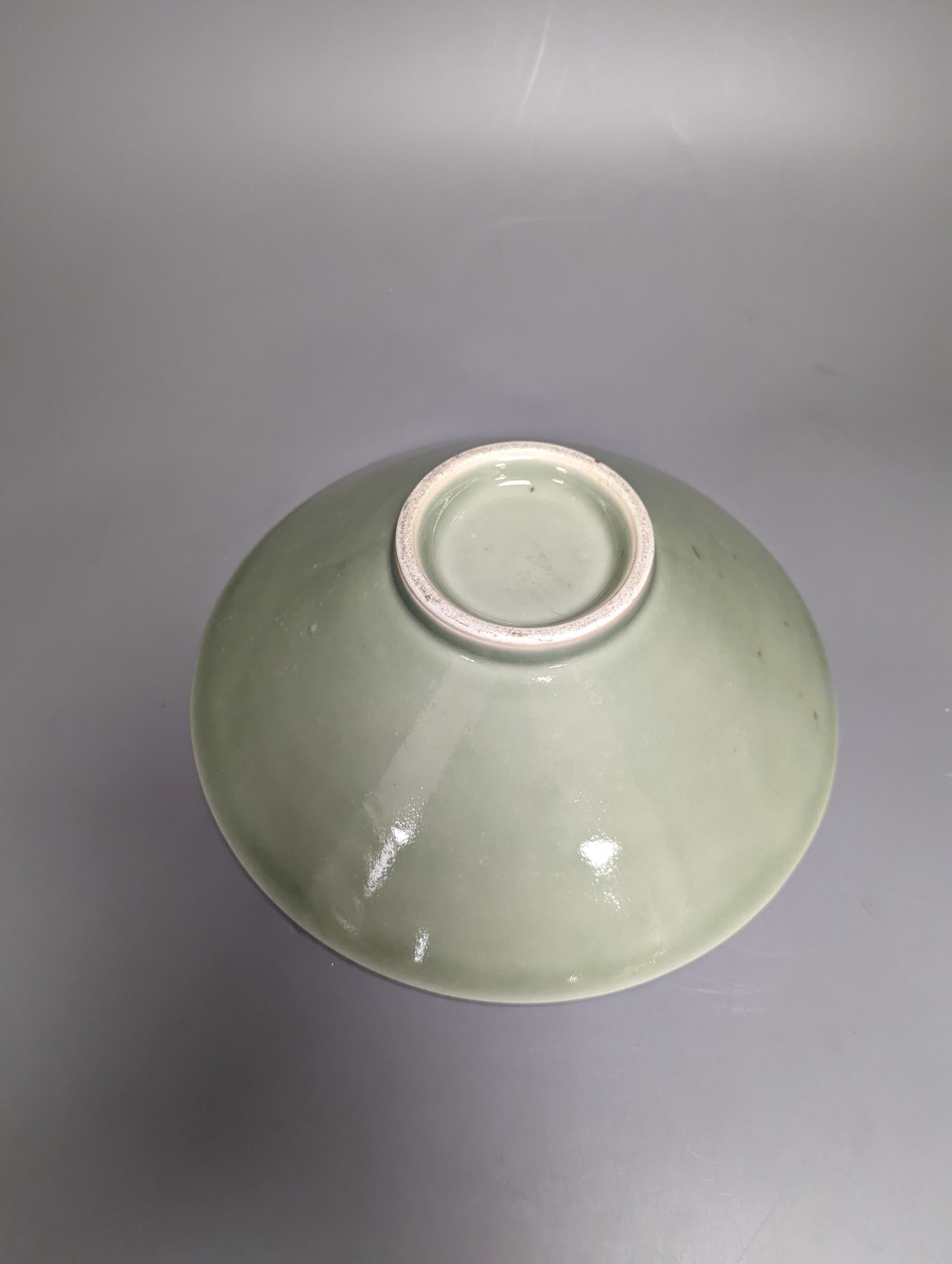 A 19th century Chinese sgraffito celadon glazed dish, diameter 26cm